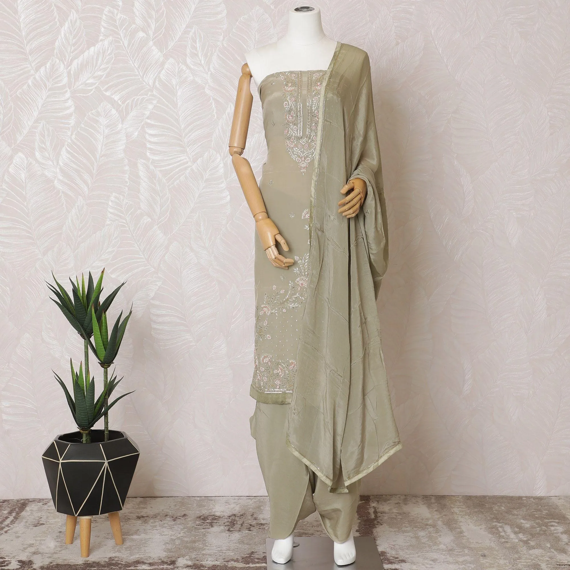 Artichoke green Premium pure silk crepe kameez with same tone embroidery, stone work and bead work in floral design. Artichoke green Plain salwar with same tone chiffon dupatta having same tone embroidery and stone work-D15570